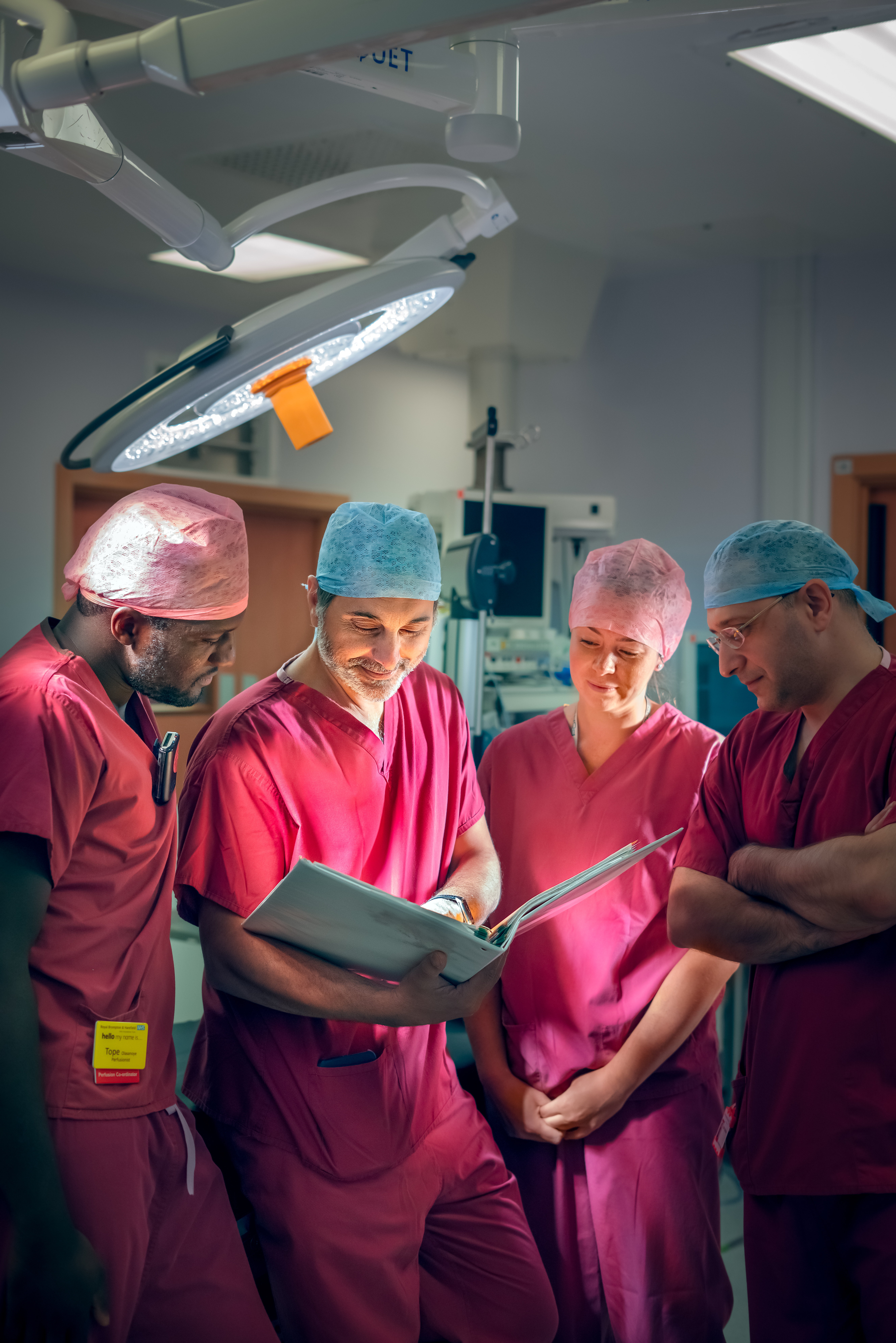 Surgeons looking at file together