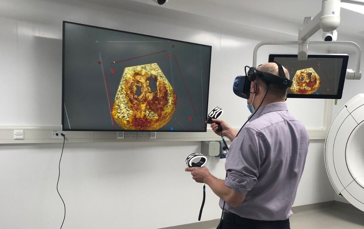 Prof John Simpson using VR technology to view images of the heart