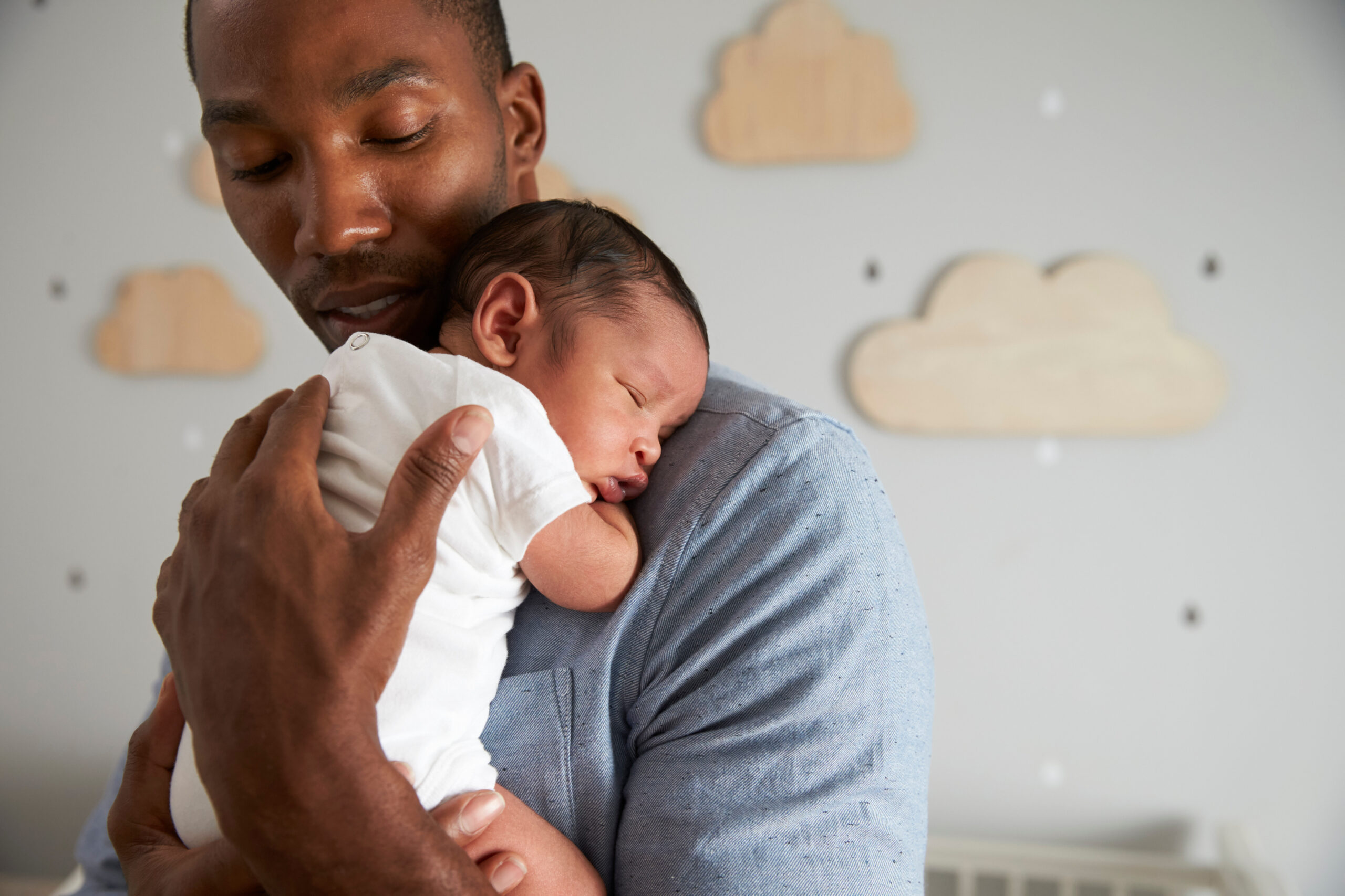 Dad cuddling with baby