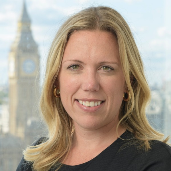 Blonde woman smiling for professional headshot
