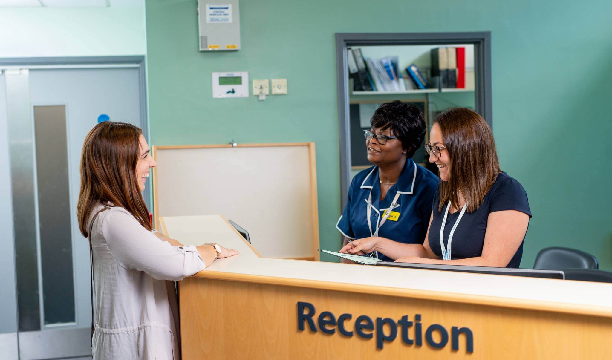 Smiling staff and patient at Westminster Bridge Consulting Rooms