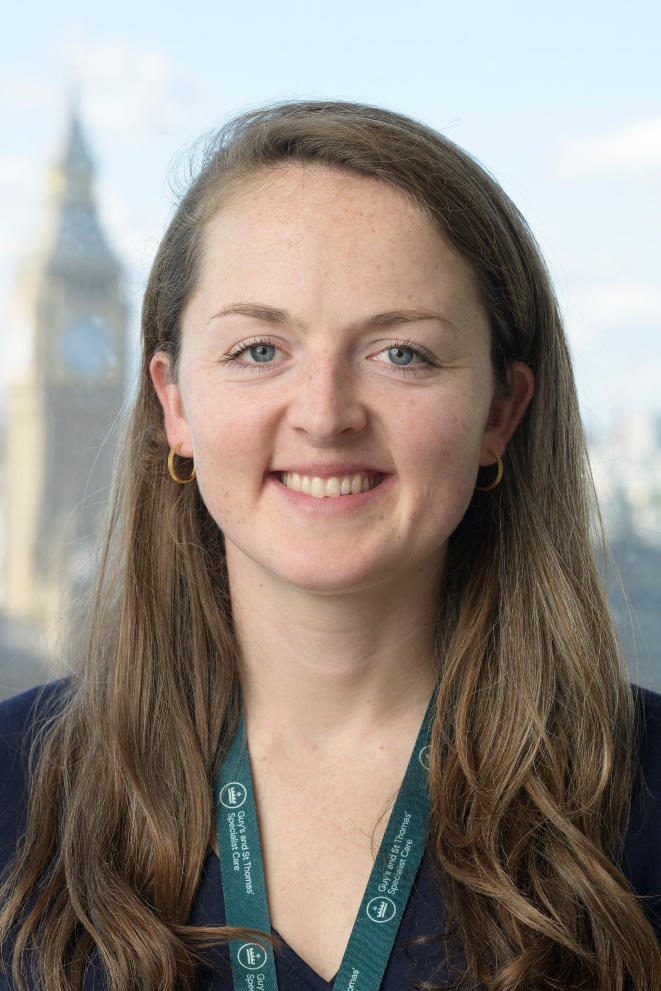 Woman with long hair smiling for professional headshot