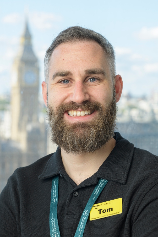 Man with beard smiling for professional headshot