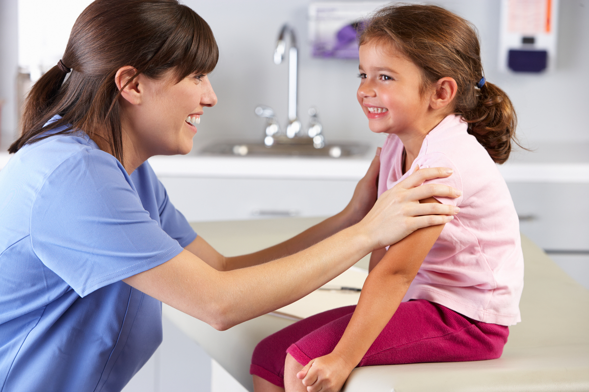 Clinician and child in clinical setting