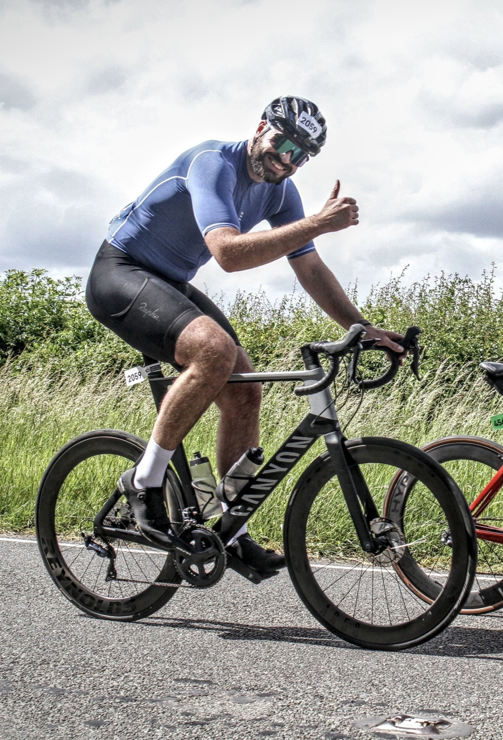 Luke taking part in a road cycling race, which he now hopes to take up again.